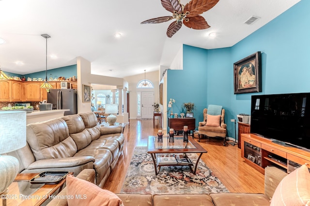 11750 Teapot Ct, Spring Hill, FL 34609 - living room with light wood-type flooring, a ceiling fan, lofted ceiling, and recessed lighting