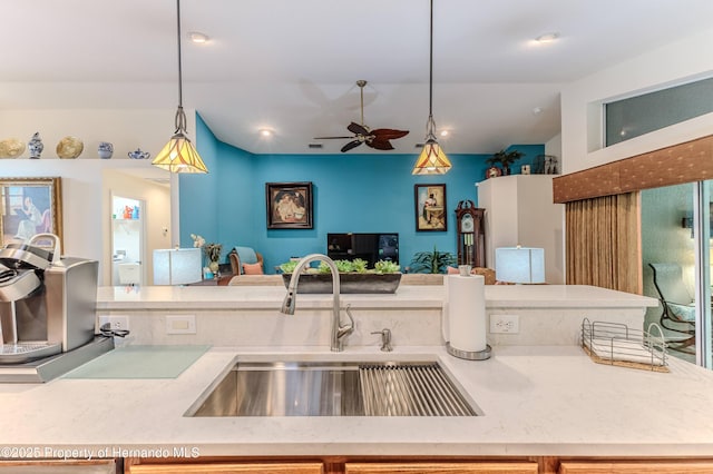 11750 Teapot Ct, Spring Hill, FL 34609 - kitchen with a sink, open floor plan, decorative light fixtures, a ceiling fan, and lofted ceiling