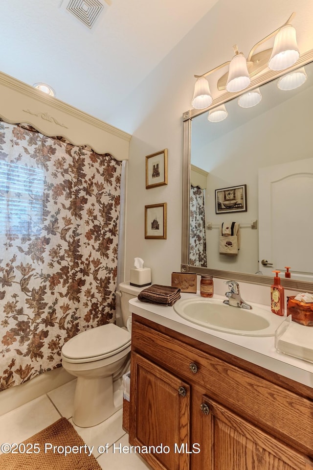 11750 Teapot Ct, Spring Hill, FL 34609 - full bath with tile patterned flooring, toilet, vaulted ceiling, vanity, and a shower with curtain
