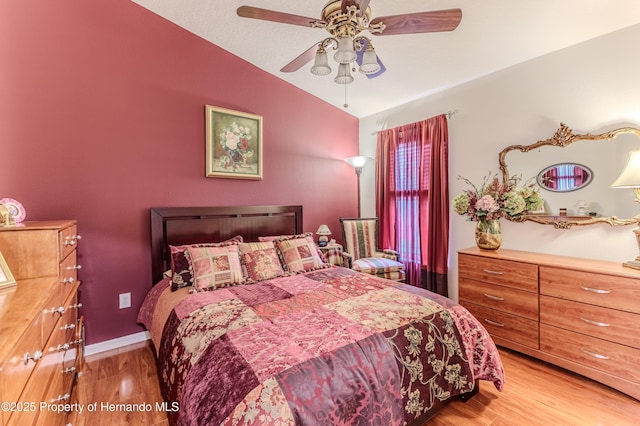 11750 Teapot Ct, Spring Hill, FL 34609 - bedroom featuring vaulted ceiling, light wood-style floors, and a ceiling fan