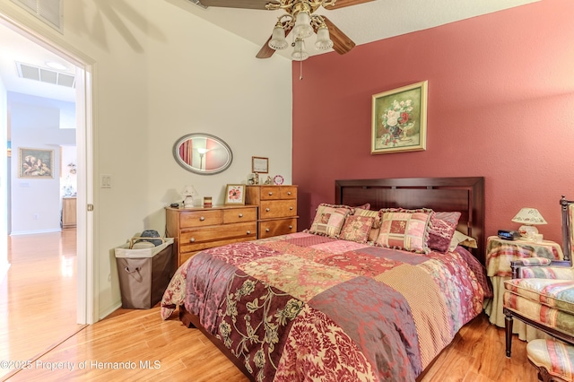 11750 Teapot Ct, Spring Hill, FL 34609 - bedroom with wood finished floors and ceiling fan