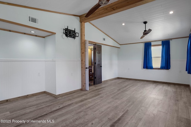spare room featuring ceiling fan, a wainscoted wall, wood finished floors, and recessed lighting