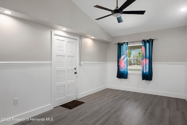 foyer featuring a wainscoted wall, a ceiling fan, wood finished floors, vaulted ceiling, and recessed lighting