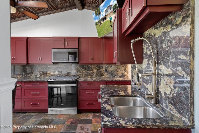 kitchen featuring appliances with stainless steel finishes, backsplash, and dark brown cabinets