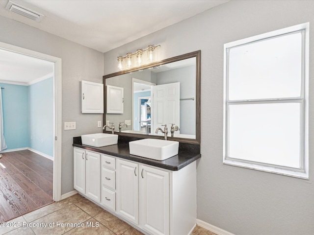 6076 Shiprock Ave, Spring Hill, FL 34608 - full bathroom with baseboards and double vanity