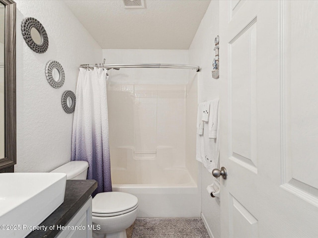 6076 Shiprock Ave, Spring Hill, FL 34608 - bathroom featuring toilet, shower / bath combo with shower curtain, vanity, and a textured wall