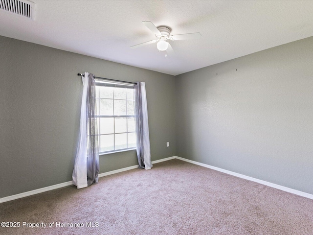 6076 Shiprock Ave, Spring Hill, FL 34608 - empty room with a ceiling fan, carpet flooring, and baseboards