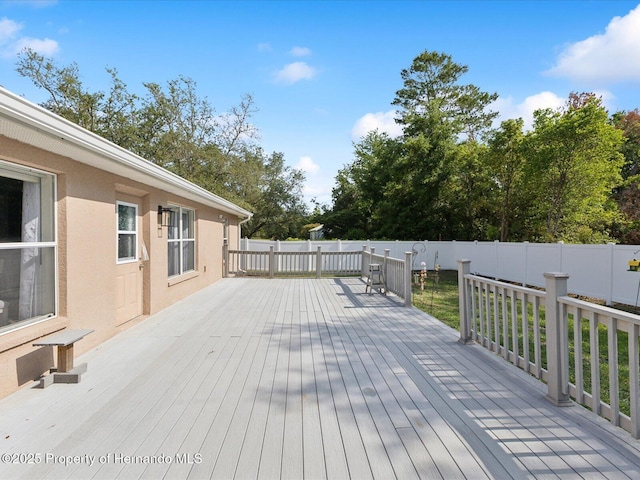 6076 Shiprock Ave, Spring Hill, FL 34608 - wooden terrace with a fenced backyard