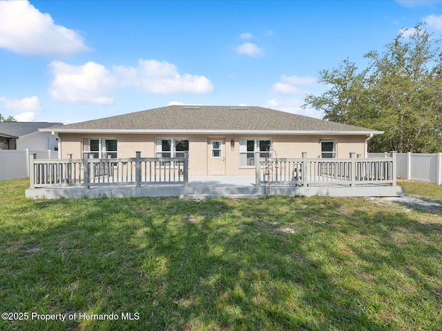 6076 Shiprock Ave, Spring Hill, FL 34608 - rear view of house featuring stucco siding and a deck