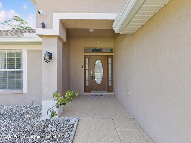 6076 Shiprock Ave, Spring Hill, FL 34608 - entrance to property featuring stucco siding