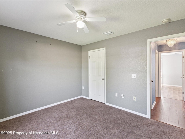 6076 Shiprock Ave, Spring Hill, FL 34608 - unfurnished bedroom featuring carpet, a chandelier, baseboards, and ceiling fan