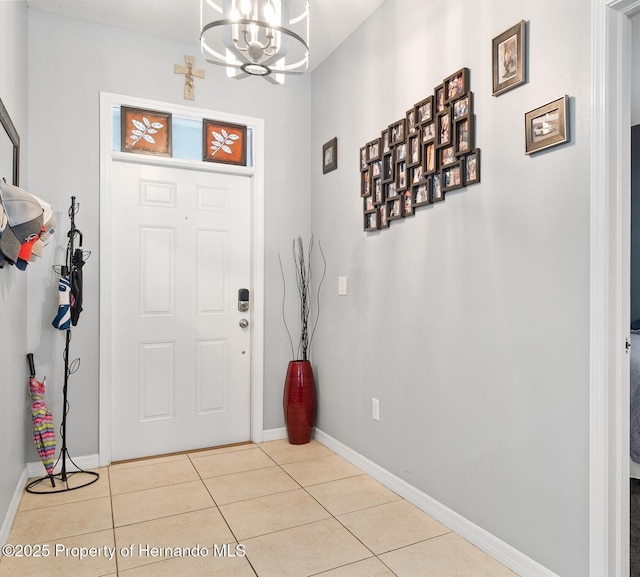 396 Winthrop Dr, Spring Hill, FL 34609 - tiled foyer featuring a chandelier and baseboards
