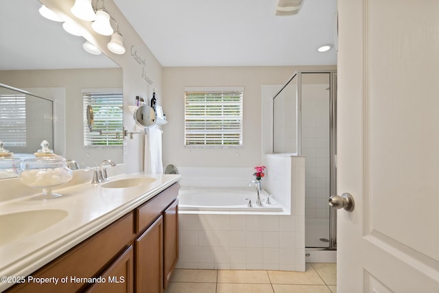 396 Winthrop Dr, Spring Hill, FL 34609 - bathroom with tile patterned flooring, a shower stall, a bath, and double vanity