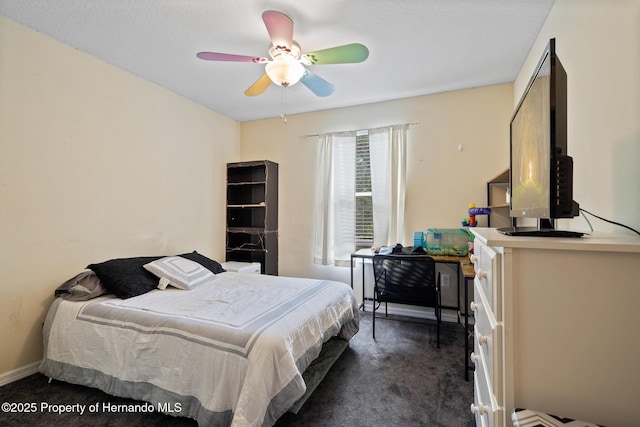 396 Winthrop Dr, Spring Hill, FL 34609 - bedroom featuring dark carpet and a ceiling fan