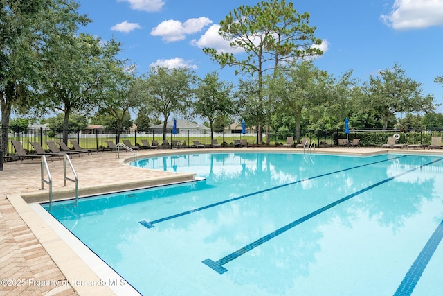 396 Winthrop Dr, Spring Hill, FL 34609 - community pool featuring fence and a patio area