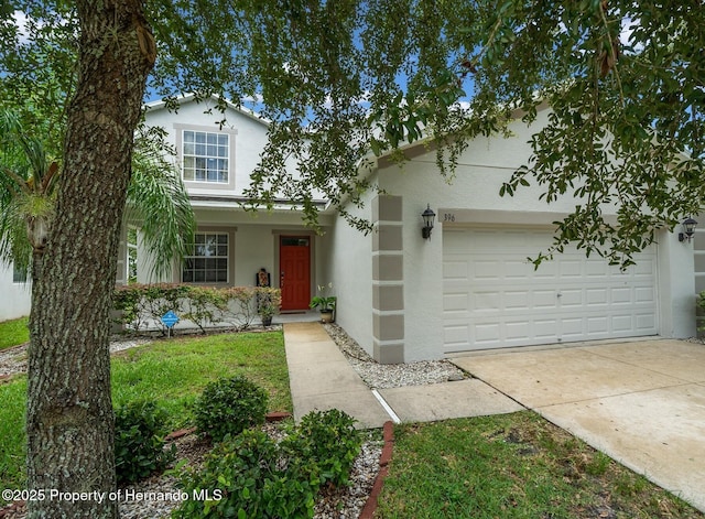 396 Winthrop Dr, Spring Hill, FL 34609 - traditional-style house featuring stucco siding, concrete driveway, and a garage