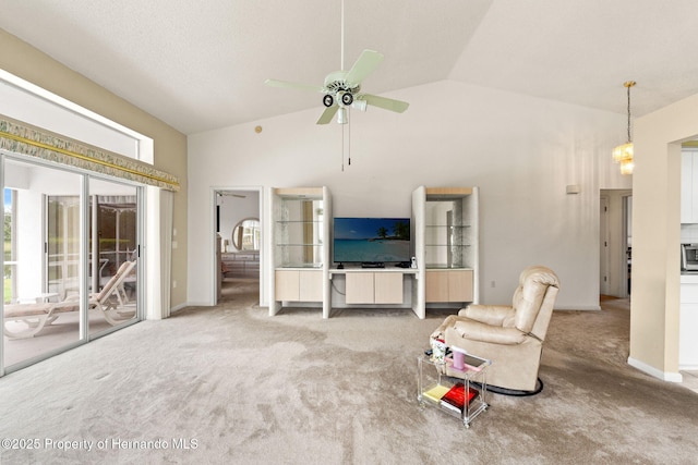 unfurnished living room with carpet floors, a ceiling fan, and high vaulted ceiling