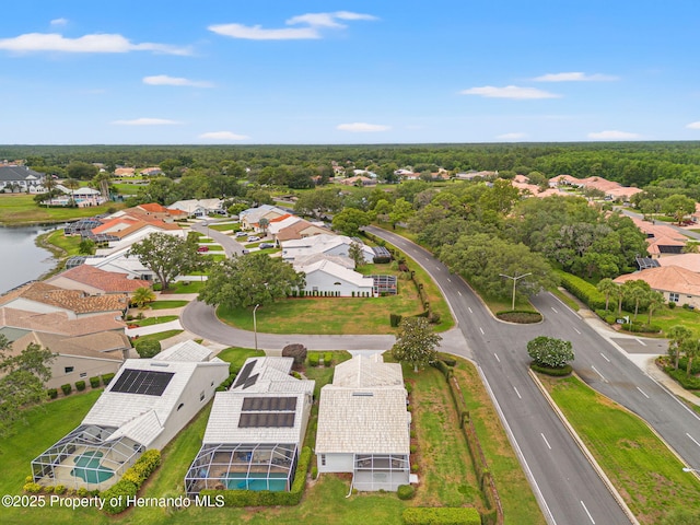 aerial perspective of suburban area featuring a nearby body of water