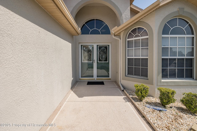 284 Quane Ave, Spring Hill, FL 34609 - view of exterior entry featuring stucco siding