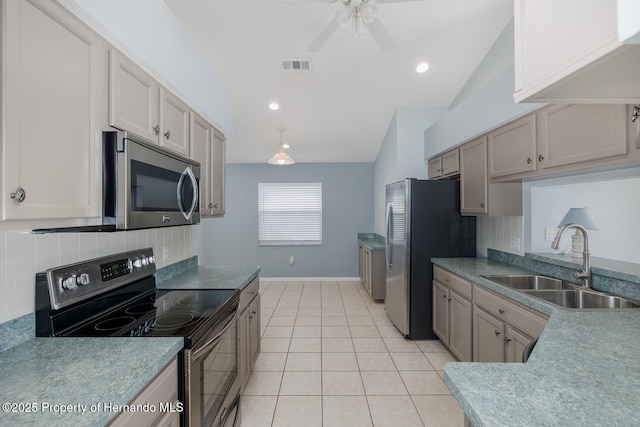284 Quane Ave, Spring Hill, FL 34609 - kitchen with appliances with stainless steel finishes, a sink, vaulted ceiling, tasteful backsplash, and ceiling fan