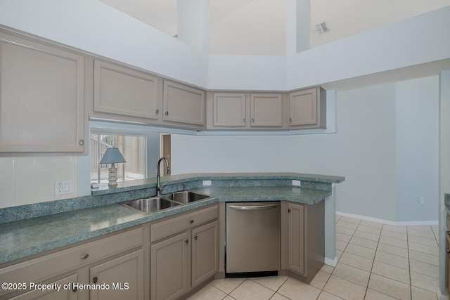 284 Quane Ave, Spring Hill, FL 34609 - kitchen with dishwasher, a sink, light tile patterned floors, dark countertops, and a towering ceiling