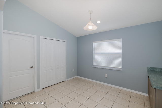 284 Quane Ave, Spring Hill, FL 34609 - unfurnished bedroom with a closet, vaulted ceiling, and baseboards