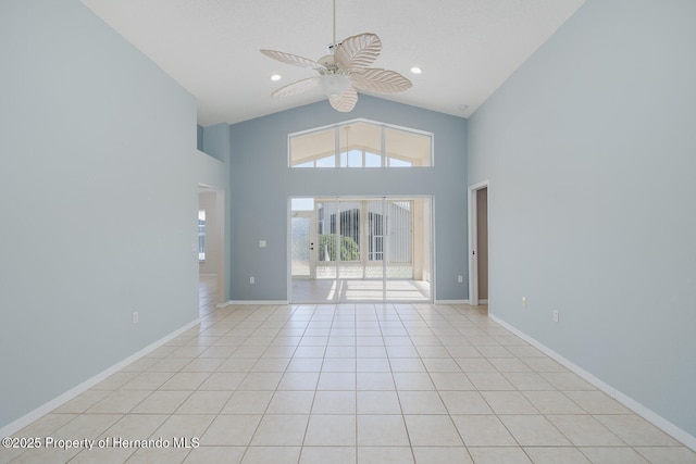 284 Quane Ave, Spring Hill, FL 34609 - spare room with a ceiling fan, healthy amount of natural light, high vaulted ceiling, baseboards, and light tile patterned floors