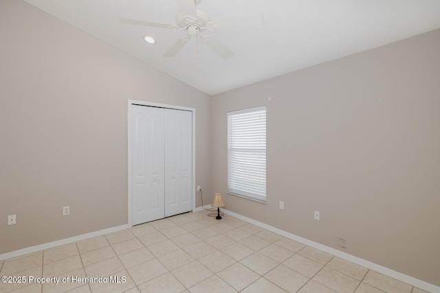284 Quane Ave, Spring Hill, FL 34609 - unfurnished bedroom with vaulted ceiling, a closet, baseboards, ceiling fan, and recessed lighting