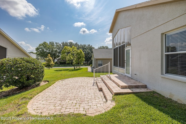 284 Quane Ave, Spring Hill, FL 34609 - view of green lawn with a patio area