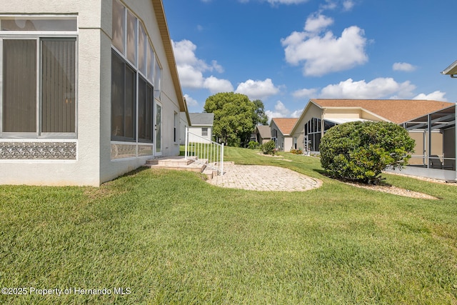 284 Quane Ave, Spring Hill, FL 34609 - view of green lawn with a patio area