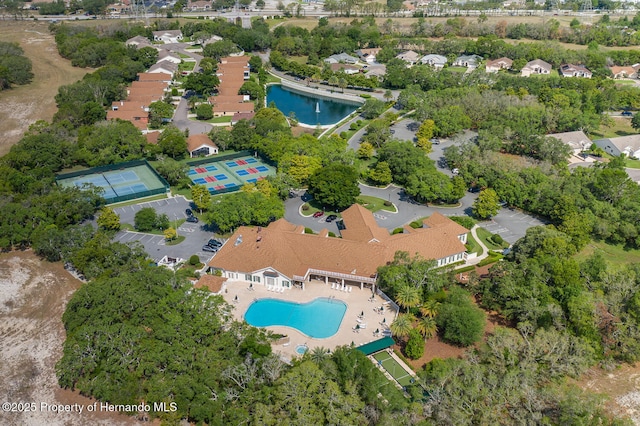 284 Quane Ave, Spring Hill, FL 34609 - aerial view of property and surrounding area featuring a pool area and nearby suburban area