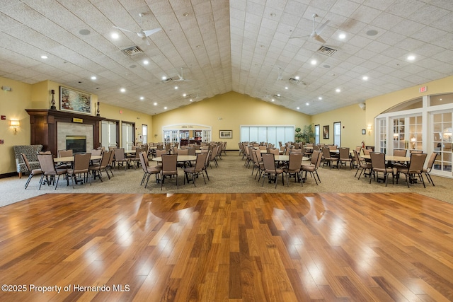 284 Quane Ave, Spring Hill, FL 34609 - dining area with hardwood / wood-style floors, lofted ceiling, carpet floors, and recessed lighting