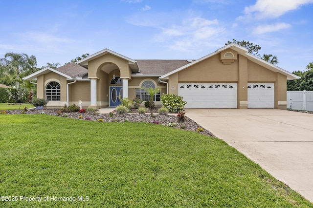 single story home featuring stucco siding, an attached garage, and concrete driveway