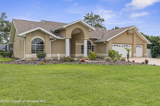 ranch-style house with stucco siding, an attached garage, driveway, and a front lawn