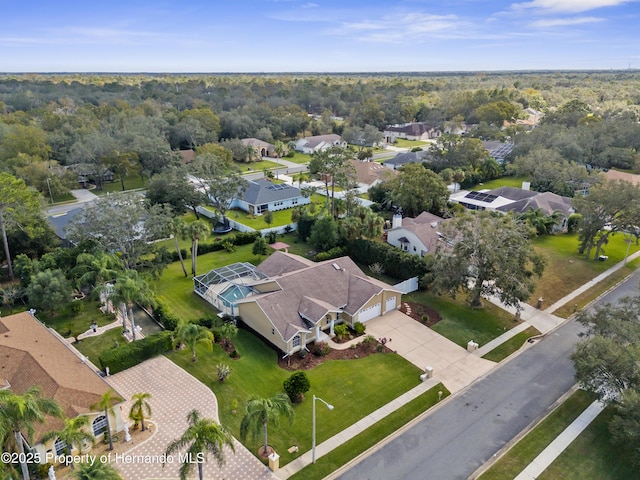 aerial view of property and surrounding area featuring nearby suburban area