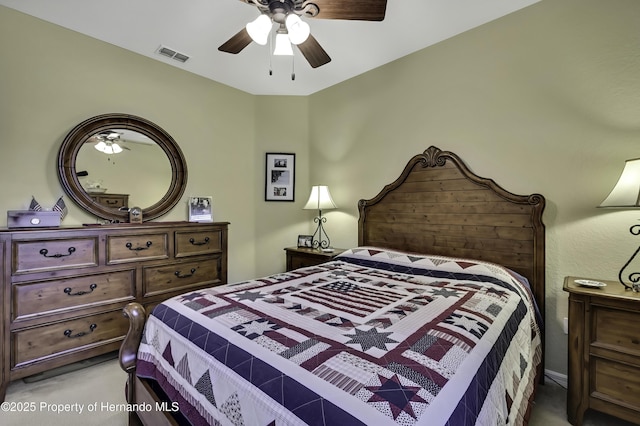 bedroom featuring ceiling fan and light carpet