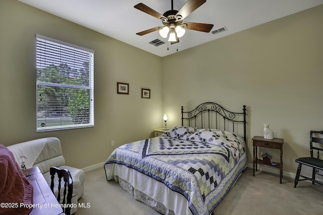 bedroom featuring baseboards, light carpet, and ceiling fan