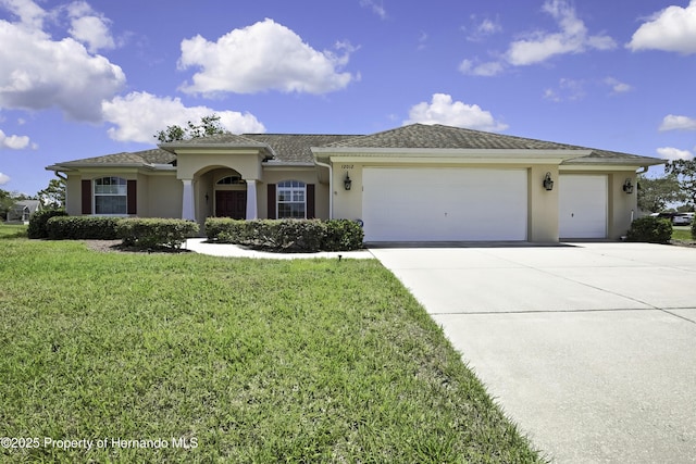 view of front of property with an attached garage, concrete driveway, and stucco siding