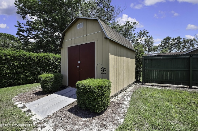 view of shed with fence
