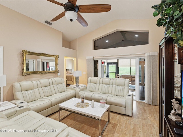 11350 Copley Ct, Spring Hill, FL 34609 - living area featuring high vaulted ceiling, a ceiling fan, and light wood finished floors