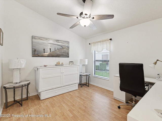 11350 Copley Ct, Spring Hill, FL 34609 - home office with lofted ceiling, light wood-style flooring, ceiling fan, and baseboards