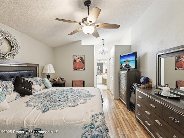 11350 Copley Ct, Spring Hill, FL 34609 - bedroom with vaulted ceiling, a textured ceiling, light wood-type flooring, ensuite bathroom, and a chandelier