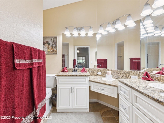 11350 Copley Ct, Spring Hill, FL 34609 - bathroom with tile patterned flooring, vanity, and toilet