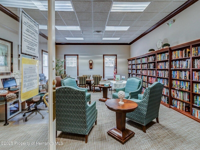 11350 Copley Ct, Spring Hill, FL 34609 - sitting room with ornamental molding, carpet flooring, and bookshelves