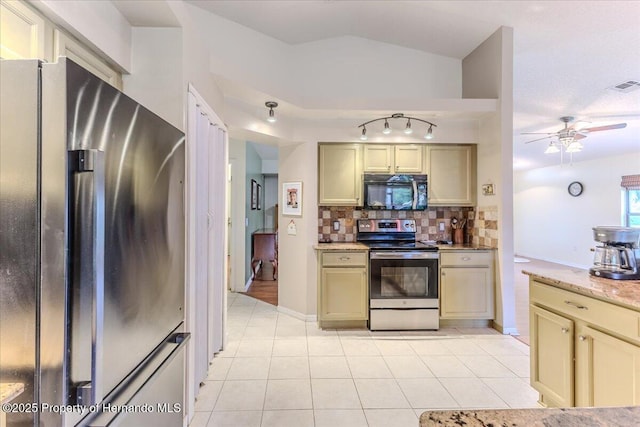 kitchen featuring appliances with stainless steel finishes, tasteful backsplash, ceiling fan, light tile patterned floors, and cream cabinetry