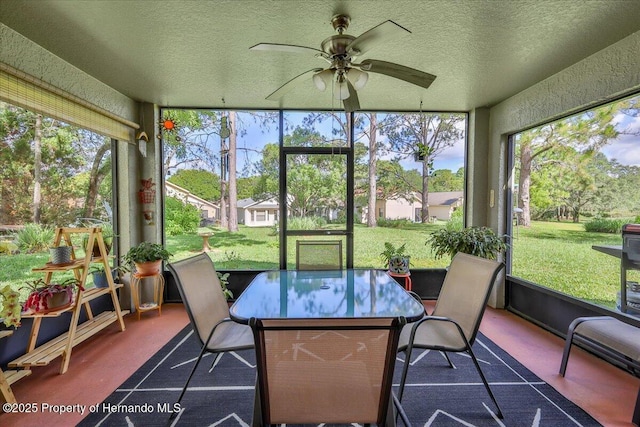 sunroom with a textured ceiling and carpet