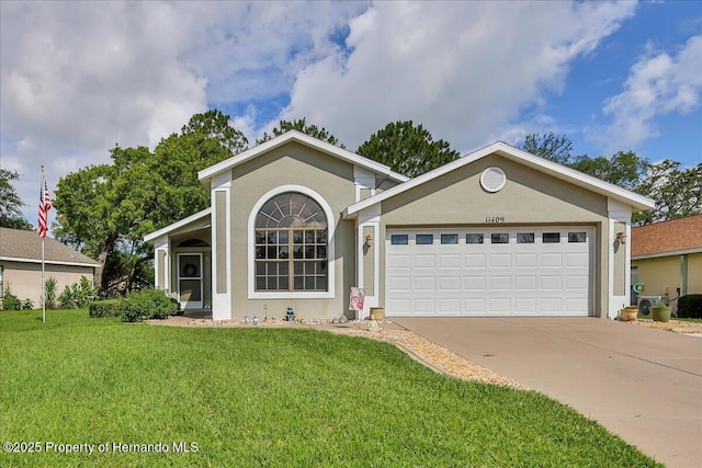 view of front of home featuring a garage, a front yard, concrete driveway, and stucco siding