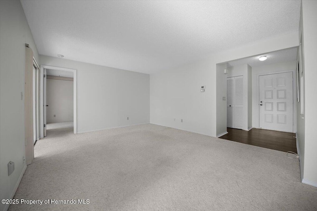 spare room featuring carpet flooring