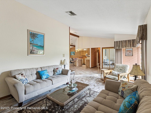 8393 Delaware Dr, Weeki Wachee, FL 34607 - living area featuring lofted ceiling and wood finished floors