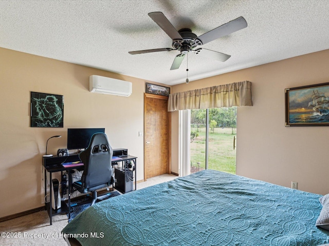 8393 Delaware Dr, Weeki Wachee, FL 34607 - bedroom featuring a wall unit AC, carpet floors, a textured ceiling, an office area, and ceiling fan